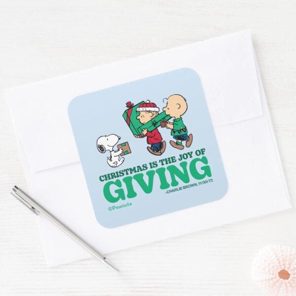 Peanuts___Christmas_is_the_Joy_of_Giving_Square_Sticker_3 Peanuts Christmas Is The Joy Of Giving Square Sticker