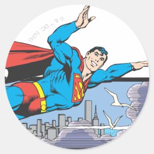 Superman_Flies_Thru_City_Classic_Round_Sticker_1 Superman Flies Thru City Classic Round Sticker