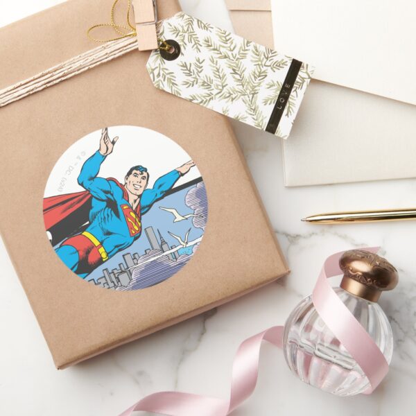 Superman_Flies_Thru_City_Classic_Round_Sticker_5 Superman Flies Thru City Classic Round Sticker