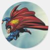 Superman_flys_with_cape_classic_round_sticker_1 Superman Flys With Cape Classic Round Sticker