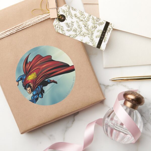 Superman_flys_with_cape_classic_round_sticker_5 Superman Flys With Cape Classic Round Sticker